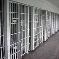 Bureau of Prisons Punished Whistleblower by Assigning her to a Converted Jail Cell without a Phone or Desk